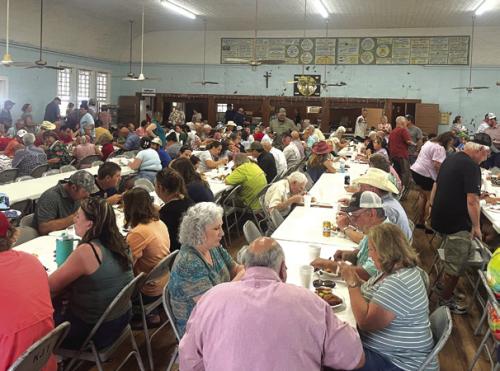 Attendees feast at the annual Ammannsville church picnic every year on Father’s Day.