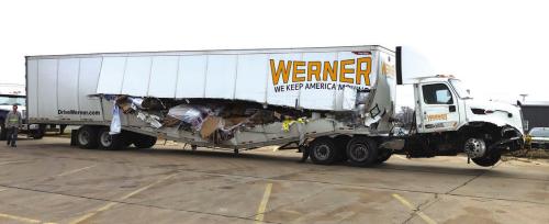 After getting split open after it hit a guardrail in the Tuesday morning fog this truck (also pictured on the front at that scene), was hauled to the Sutherland’s parking lot to await unloading of its cargo. Photo by Bobby Bedient
