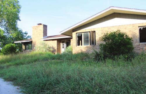 This is one of several houses on the golf course in La Grange that have not been lived in since Hurricane Harvey flooded them nearly three years ago.