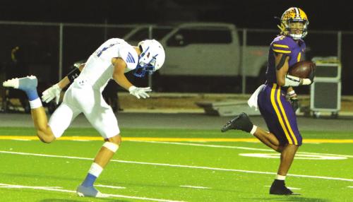 La Grange’s Bravion Rogers runs away from this Lago Vista defensive back on his way to one of his five touchdowns Friday, three rushing and two receiving. Photo by Darrell D. Gest
