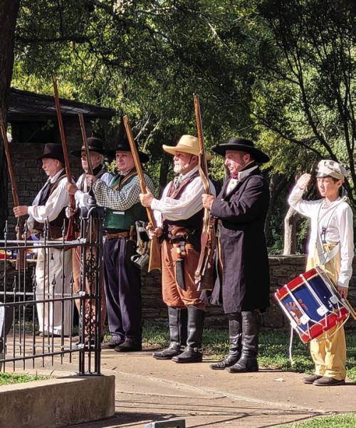 Texian reenactors line up to march to the bluff for the gun salute.