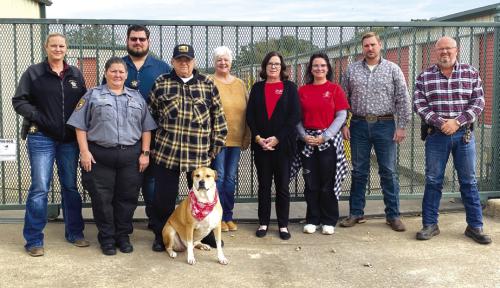 A-Prime Self Storage donated to the Deputy Santa program. Pictured from left: Sergeant Angela Lala, Corrections Officer Connie Tofel, Deputy Jeremy Castleberry, A-Prime Self Storage owner Pat Leonetti and Buster, Deputy Santa volunteers Gracie Albright, Tracy Denton and Amanda Yanis, A-Prime Self Storage Site Manager Kelly Cox, and Lieutenant David Beyer. Photo by Becky Weise
