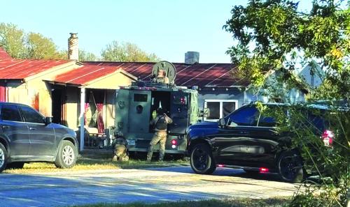 Members of the Austin County Special Response Team assisted Fayette County Sheriff’s Investigators with arresting the suspect from a brutal assault that happened in Clear Lake Pines on Thursday afternoon. The suspect was found hiding in an attic crawlspace of a building in Winch ester. Photo courtesy of the Fayette County Sheriff’s Office