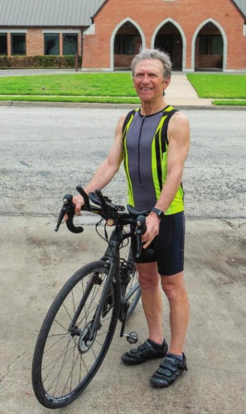 The president of the Pickleball Hall of Fame, Seymour “Rif” Rifkind, rode a bicycle into La Grange Wednesday as part of a 3,000 mile trek across America to raise funds for the Hall’s construction. Photo by Andy Behlen