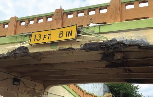 A tall load traveling on US 77 struck the underpass in Schulenburg Wednesday afternoon, April 20. The impact knocked down several chunks of concrete from the bridge overhead, one of several recent issues at the location. Record File Photo