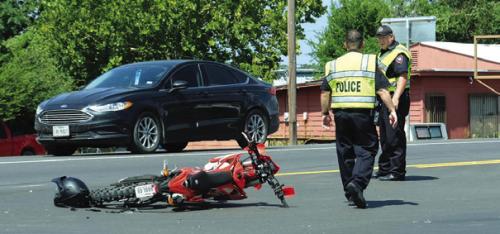 La Grange Police direct traffic following the motorcycle accident at the intersection of SH 71 Business and Country Club Dr. last Thursday.