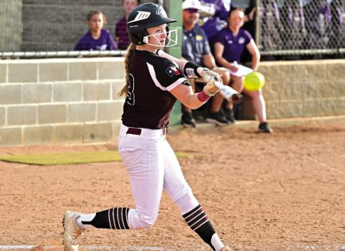 Flatonia’s Dallyn Bishop hits for The Lady Bulldogs Friday in Shiner where The Lady Bulldogs lost to the Lady Comanches. Photo by Stephanie Steinhauser