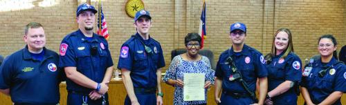 La Grange Mayor Jan Dockery signed a proclamation recognizing Fayette County EMS for being named EMS Agency of the Year by the Texas EMS Alliance. On hand for the signing were representatives from Fayette County EMS. Pictured are (from left) EMS Director Josh Vandever, Jarrett Bise, Nate Crowley, Mayor Dockery, Joseph Tavary, Alyssa Lang and Christina Sandoval. Photo by Andy Behlen