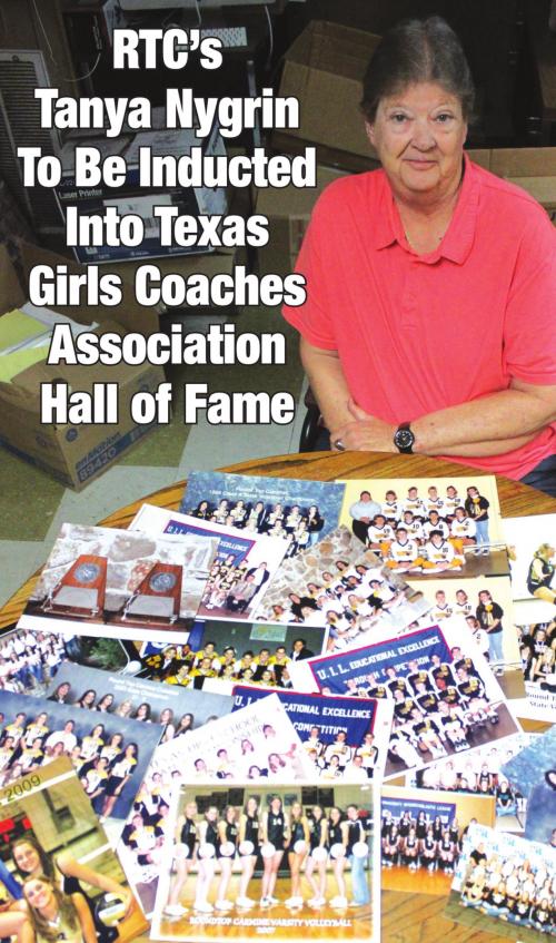 Tanya Nygrin with some of the team photos she has of her state qualifying volleyball teams.