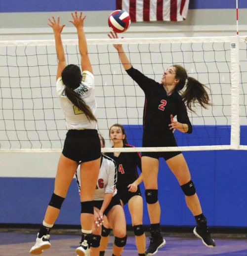 Schulenburg’s Claire Antosh spikes a ball in Tuesday’s regional semifinal match. Photos by Audrey Kn’stynik