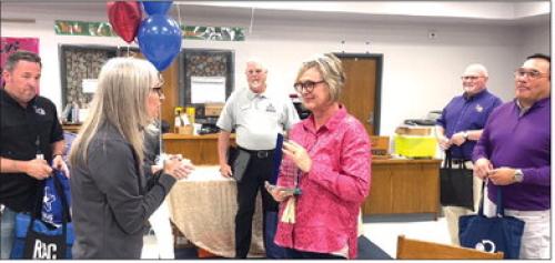 Kerry Gain, Region 13 Deputy Executive Director of Academic Services (front, left), presents the Star of the Month Award to La Grange Library Aide Pam Keilers (center). Also pictured (back, from left) La Grange Superintendent Andy McHazlett, Region 13 Deputy Director Roger Dees, La Grange School Board President Gary Drab and La Grange High School Principal John Pineda. Photo by Andy Behlen