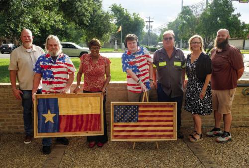Local Craftsman Donates Wooden Flags for City Hall