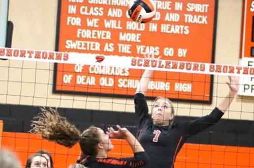 Schulenburg’s Kloe Kutac prepares to spike the ball after the set from Tamara Otto in Friday’s win over Industrial. Photo by Audrey Kristynik