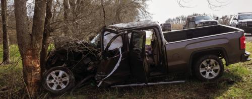 The driver of this GMC Sierra suffered serious injuries after his pickup went off the road and hit a tree near Mullins Prairie Thursday. Photo by Andy Behlen