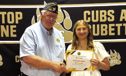 Lyn Reavis, Post Commander of American Legion Post #338 presents the Citizenship Award and Scholarship to Gretchen Sacks of Round Top-Carmine High School.
