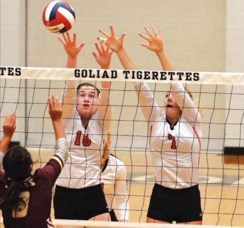 Schulenburg’s Morgan Marburger, 18, and Kloe Kutac, 7, jump to try to block this Pettus hit Thursday. Photos by Audrey Kristynik
