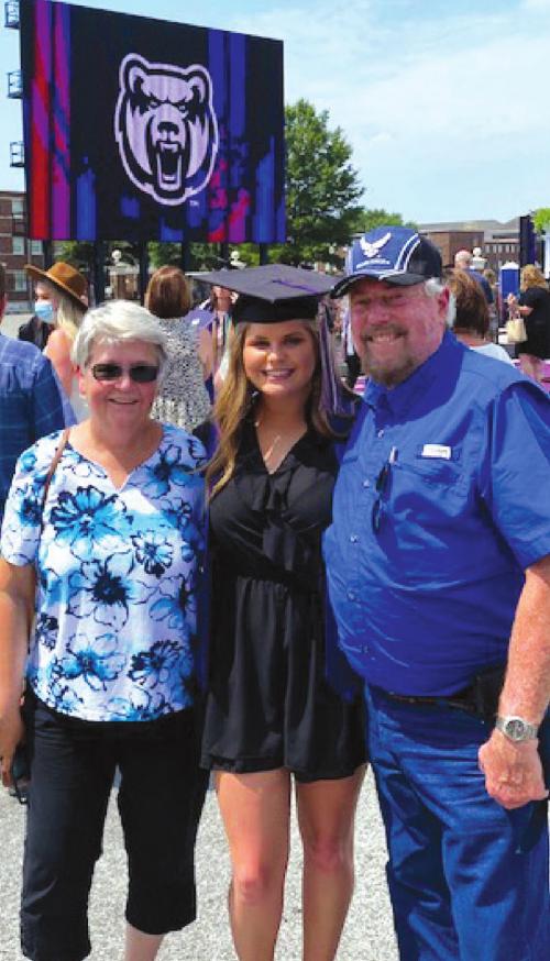Pam and Ron Knotts with granddaughter Keylee Simpson at the University of Central Arkansas graduation ceremony.