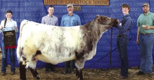 GRAND CHAMPION HEIFER OVERALL &amp; GRAND CHAMPION HAIRED HEIFER– CASH SMITH, FAYETTEVILLE 4-H &amp; FFA; Grand Champion Buckle Sponsor – KPK Manufacturing Indie Sikes – Holding Banner, Judge Caleb Boardman, Todd Smith, Cash Smith and Bradley Klesel – KPK Manufacturing