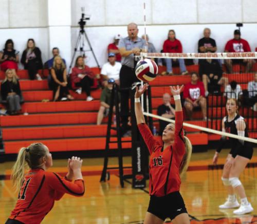 Schulenburg’s Jenna Guentert sets the ball for teammate Saybra Pinney in Tuesday’s match. Photo by Audrey Kristynik