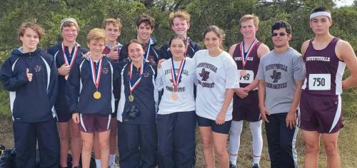 The Fayetteville boys and girls varsity cross country runners with their medals.