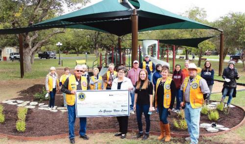 Pictured receiving the grant are Lion Ken Morris, Mayor Janet Moerbe, Library Director Allison MacKenzie, Lions Diana and Sam Wilson. Photo by Jeff Wick