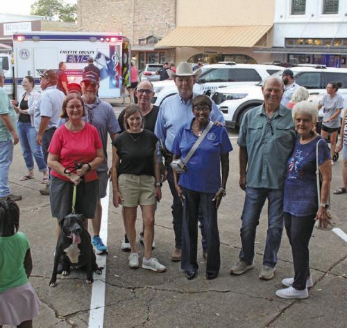 National Night Out event in downtown La Grange on Oct. 8 drew a big crowd. Shown here are city council members, Mayor Jan Dockery, Police Chief David Gilbreath and City Manager Jack Thompson taking a break from the festivities to pose for a photo. Photo by Jeff Wick