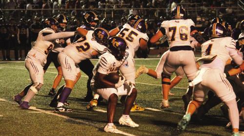La Grange’s Dillan Johnson looks for running room behind a big group of Leopard blockers, left to right, Khris Cuevas (90), Trey Brumley (72), Jahir Lopez Ocon (55), Whitaker Samples (76) and Casen Conrad (4). Photo by Jeff Wick
