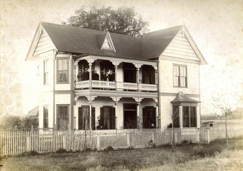This 1890s photograph pictures Augusta (Willenberg) and William Hermes, Jr., Louise (Holste) and Dr. William Hermes, and August Hermes on the upper balcony of William Hermes, Jr.’s home, at 541 North Main Street, La Grange.