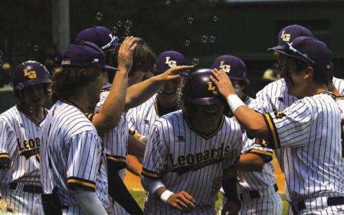 With every run the Leps scored Monday there was quite a celebration, including a tunnel and bubbles. Here Bennett Barber comes home with La Grange’s second run of the game.