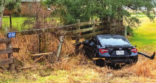 A crash hydroplaned on SH 159 and crashed into a fence during the rain on Monday morning, Jan. 31. Photo by Andy Behlen