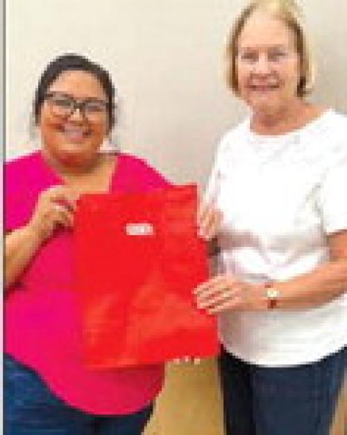 Pictured is Rosalinda Gonzalez, H-E-B Service Manager and Linda Oltmann, AMEN Board member.
