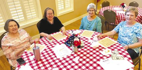 Chapter members enjoying a game of Czech-English bingo.