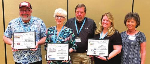 Sweepstakes award winners at the 84th annual Gulf Coast Press Association convention Saturday in Sugarland were, from left to right: In the small weekly category, The Flatonia Argus (publishers Paul Prause accepting award); In the large weekly category, The Port Aransas South Jetty (Owners Mary and Murray Judson accepting the award) and in the semi-weekly category, The Fayette County Record (owners Regina Keilers and Nonnie Barton accepting the award).