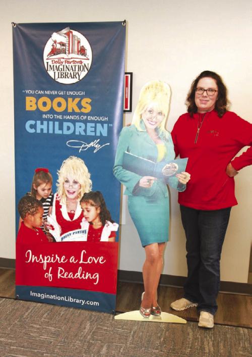 Fayette Electric Cooperative Marketing and Training Manager Tracy Denton poses next to “Dolly” who travels around Fayette and surrounding counties to spread the word about Fayette EC’s partnership with the Dolly Parton Imagination Library.