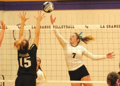 La Grange’s Natalie Blackwell tips the ball over in the match against Giddings last Saturday. The two teams face off again this Friday. Photo by Jeff Wick