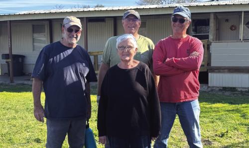 Ms. Bennie Lou Liere and left to right Habitat volunteers Steve Hardin, Matt Holdeman, and Doug Elliott.