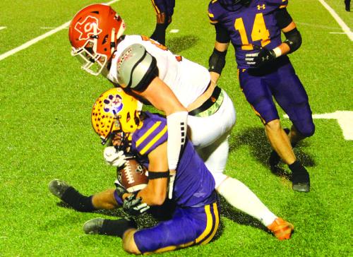 Leopard Max Dixon holds tight to this interception Friday. Photo by Jeff Wick