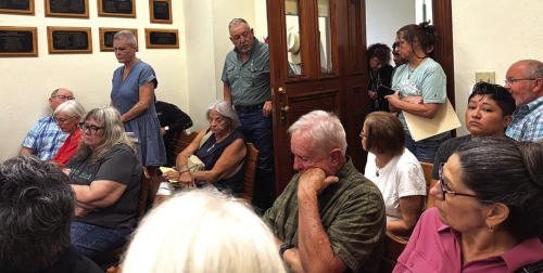 A standing room-only crowd filled the Commissioners Court meeting room last Friday for a special meeting over the County’s participation in Operation Lone Star. Photo by Andy Behlen