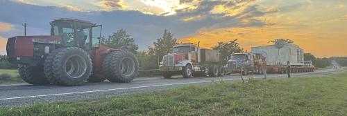 Hostyn Hospitality, and a Big Tractor, Gets Convoy Up the Hill