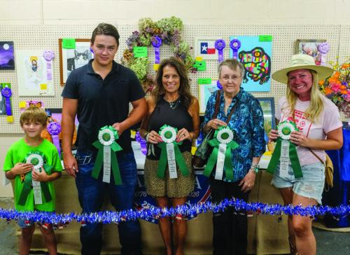 BEST OF THE CREATIVE ARTS DEPARTMENT From left, Jensen Sutherland won best of department in the child division for a ship; Austin Anderson won best of department in the teen division for a chair; Anissa Menefee won best of department in the adult division for a puzzle; Marcia Burchard won best of department in the semi-professional division for an orange purse; Kayli Head won best of department in the professional division for a wreath.