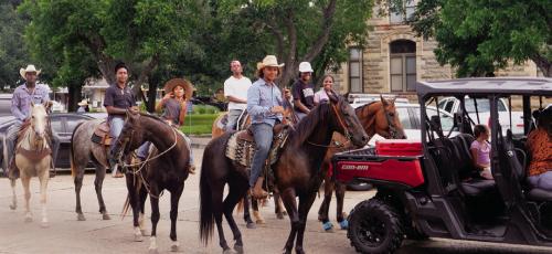 The Juneteenth trail riders pose for the camera during a pause in the parade in front of the courthouse. More photos on Page A6 today. Photo by Andy Behlen