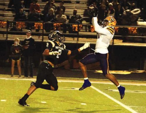 La Grange’s Bravion Rogers leaps to make this catch against the defense of Giddings’ Kolbie Clemons, and then would still be able to stay on his feet and run the ball into the endzone for a 57 yard touchdown Friday. Photo by Jeff Wick