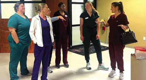 La Grange Family Health CFO Dawn Blackwell, right, walks several La Grange Family Health staffers through what will be their new clinic at the St. Mark’s Medical Office Building.