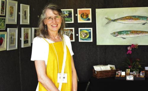 Diane Peterson with her booth at last year’s ArtWalk.