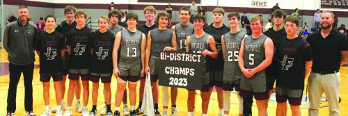 The members of the Fayetteville boys basketball team pose after their playoff win over Nordheim in Flatonia Tuesday. Photos by Jeff Wick