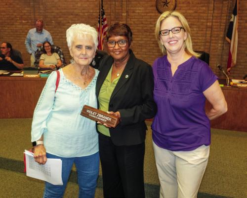 La Grange Mayor Jan Dockery (center) presented outgoing Ward 2 City Council member Violet “Patsy” Zbranek (left) with her nameplate from the Council chamber. They are pictured with City Secretary Janet Bayer (right). Photo by Andy Behlen