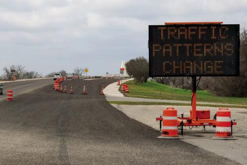 A sign on Business 71 (Travis St.) advises motorist of the upcoming traffic pattern changes on Feb. 23. The old river bridge will reopen on that day after more than two years for repairs and rehabilitation. When it opens, the old bridge will carry westbound traffic in a single lane while eastbound traffic will remain on the new concrete bridge, also in a single lane. Photo by Andy Behlen