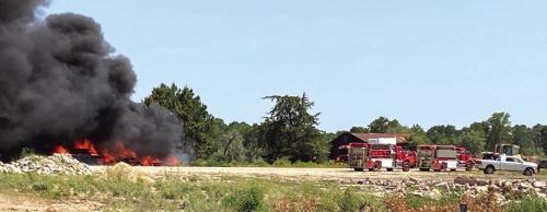 The thick back smoke of the creosote post/railroad tie fire could be seen for miles Saturday. Photo by Eric Skonberg