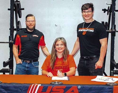 La Grange Senior Powerlifter Danyelle McIntyre, a 6th place State finisher, signed a letter of intent to join the Sam Houston State University Powerlifting team last week. She is shown, center, at her signing ceremony. Left is SHSU powerlifting coach Michael Hafenbrack, and right is Danyelle’s brother Hadyn McIntyre, himself an SHSU powerlifter.