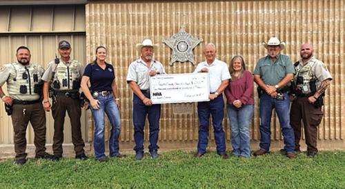 Deputies receiving the grant check, left to right are-Deputy Herman Olvera, Sgt. Ron Naumann, Sgt. Angela Lala,, Sheriff Keith Korenek, Dennis Brower-Friends of NRA, Renee Moreland, Lt. David Beyer, and Deputy Joe Gonzales.